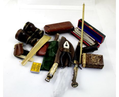 A collectors' lot to include an embossed leather cigar case, opera glasses, a cased harmonica, scrimshaw-handled knife, horn-