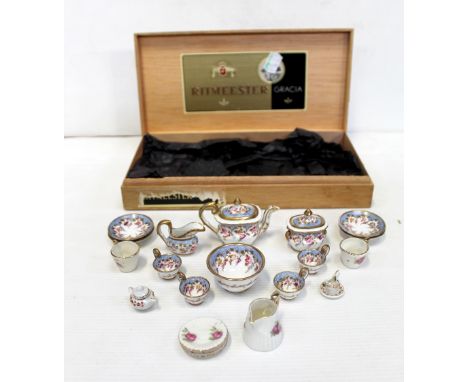 A miniature Victorian porcelain part tea service, hand painted with gilt and floral decoration in blue borders and various ot