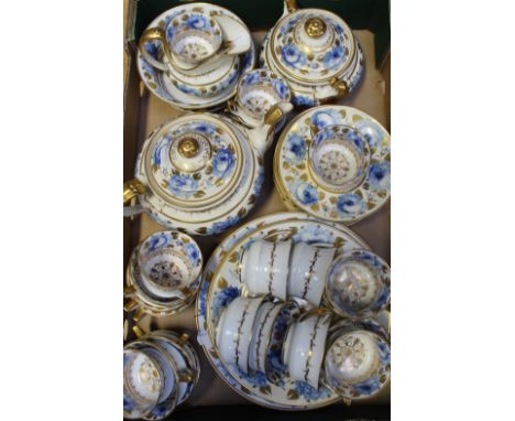A 19th century Davenport hand painted and gilt decorated tea service, decorated with blue roses, anchor mark to base. CONDITI