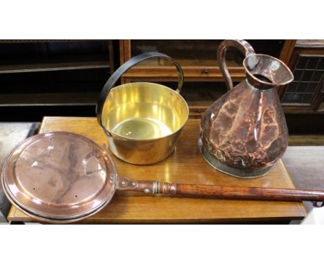 A Victorian copper haystack jug, a brass jam pan and a copper warming pan (3).