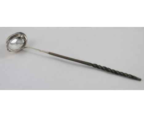 A 19th century white metal toddy ladle with baleen handle, unmarked, length 37cm. CONDITION REPORT Dents to the ladle, the ha
