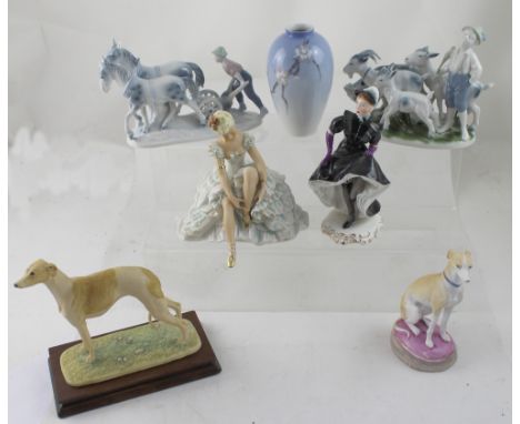 A collection of figurines and figure groups to include a Goebel dancer, Adderley 'Can-Can Babette', Border Fine Arts whippet,