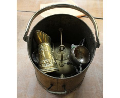 A quantity of assorted brassware to include teapot, trivet, fire irons etc.