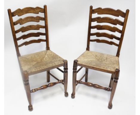 A part set of five (4+1) ladder-back elm dining chairs with rush seats and a reproduction refectory table, length 145cm (6).