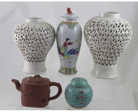 A group of Chinese ceramics comprising a near pair of blanc de Chine reticulated baluster vases (bases drilled), height of la