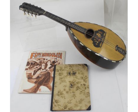 A 1920s Italian lute back mandolin with segmented rosewood back and spruce top, bears label for Bossard-Bonnel Rennes.