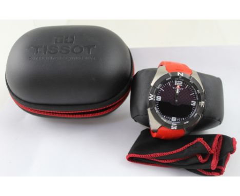A Tissot solar powered titanium T Touch wristwatch on red rubber strap, the dial set with Roman and baton numerals, model no.