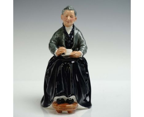 Charming Royal Doulton figurine titled The Cup of Tea, model HN2322, depicting an elderly woman seated with a teacup in hand 