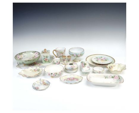 Charming 19-piece assorted porcelain lot featuring hand-painted floral designs in rose and pastel palettes, unified by delica