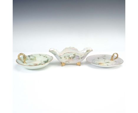 This exquisite three-piece set of hand painted porcelain bowls includes two finely crafted Limoges bowls with gilt loop handl