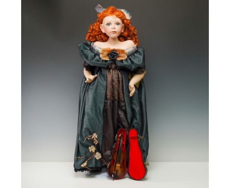 This Seymour Mann Signature Series porcelain doll, designed by Jackie Lee, features a striking red-haired figure with a refin
