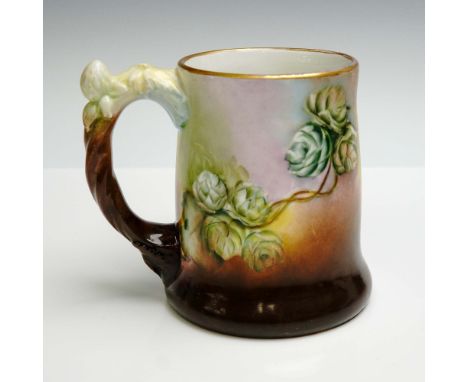 Porcelain tankard made by Jean Pouyat Limoges, France, dated 1908 and signed R. Gurney on the underside. The exterior is deco