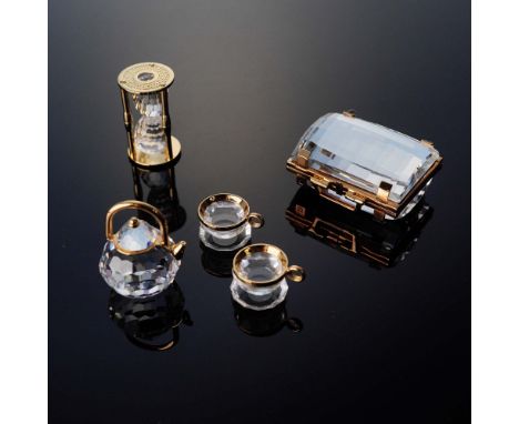 This delightful trio from Swarovski's Crystal Memories collection includes a miniature crystal tea set with gold-tone accents