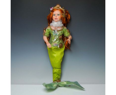 This fantasy-themed porcelain collector doll features a unique mermaid-fairy hybrid design, dressed in a shimmering green cos