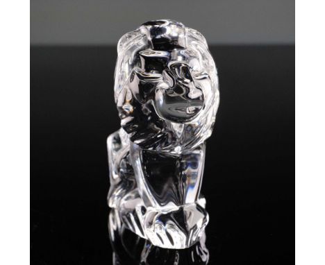 A striking clear crystal Steuben Sitting Lion paperweight figurine featuring smooth, abstracted lines that create an elegant 