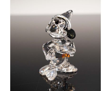 This retired Swarovski crystal figurine features Disney's beloved Mickey Mouse dressed as the Sorcerer's Apprentice from Fant