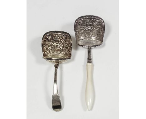 A George III silver gilt caddy spoon, the shovel bowl cast with shell, floral and scroll ornament, by Joseph Willmore, Birmin