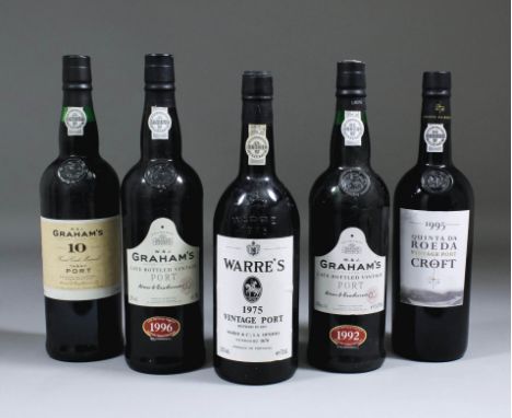 A bottle of 1975 Warre's Vintage Port (bottled by Warre & Co 1977), a bottle of 1907 Quinta da Roeda Vintage Port, two bottle