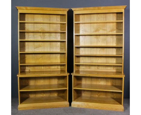 A pair of modern ash open front bookcases made by Jonathan Morriss of Bruton, Somerset, the upper parts with moulded cornice,