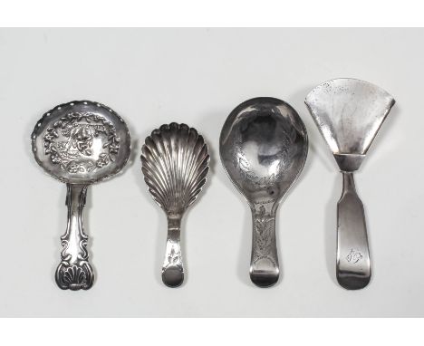 Three George III silver caddy spoons, - with oval bowl embossed with a seated figure and dog within a floral garland by John 