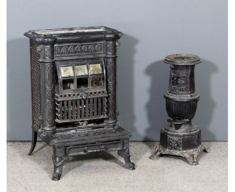 A late 19th Century French black enamel cast iron stove, 19.5ins x 28.5ins high, and a small late 19th Century French cast ir