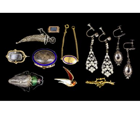 A late Georgian gold coloured metal mounted and enamel oval pattern mourning clasp for an eight strand necklace or bracelet, 