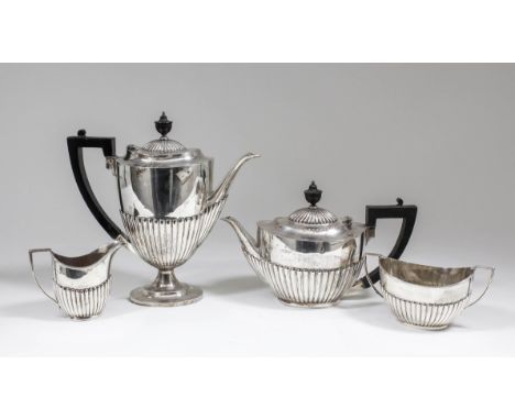 An Edward VII and George V silver Harlequin four piece tea and coffee service of Georgian design with oval part reeded bodies