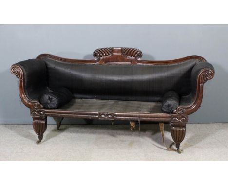 A William IV mahogany framed scroll end sofa, the moulded showwood frame with floral and reeded cresting, scroll carved arm t