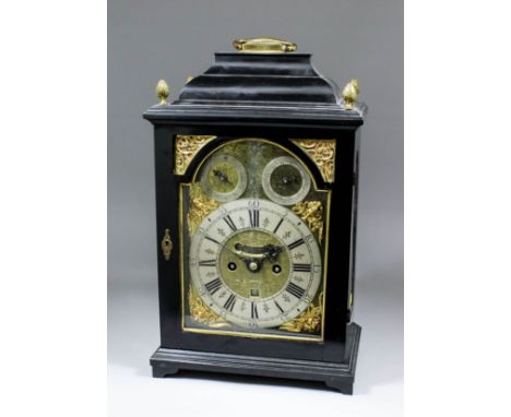 An early 18th Century ebonised table clock by Joseph Jackman of London Bridge, the 7.5ins arched brass dial with wide silvere