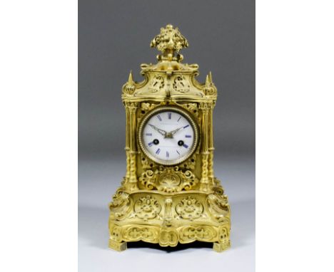 An early 19th Century French ormolu cased mantle clock, the 2.75ins diameter white enamelled dial with blue Roman numerals in