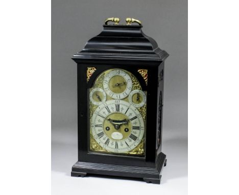 An early 18th Century ebonised table clock by John Topping of London, the 6ins arched brass dial with wide silvered chapter r