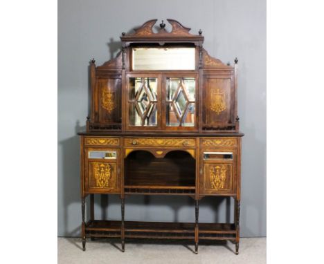 A late Victorian rosewood side cabinet inlaid with boxwood stringings and swags and leaf scroll ornament, the upper part with