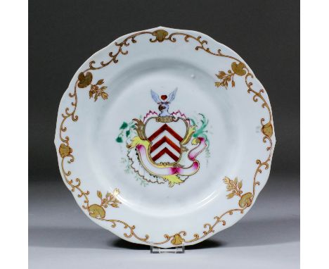 A Chinese armorial "Famille Rose" porcelain circular plate of shaped outline, the centre enamelled in colours with the coat o