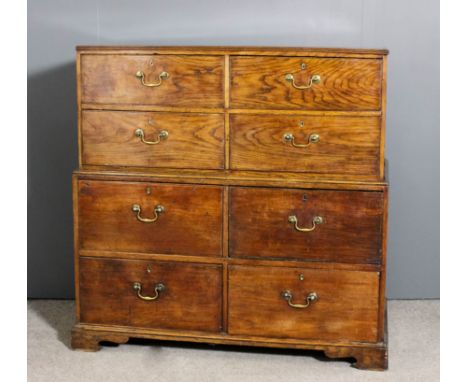 A late 18th/early 19th Century elm chest on chest with reeded edge to top, the upper part fitted four short deep drawers, the