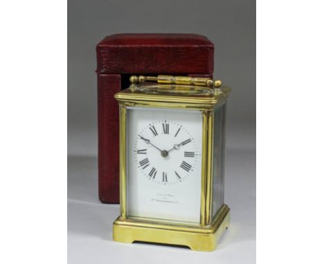 An early 20th Century French carriage clock retailed by Jas. Shoolbred & Co, the white enamelled dial with Roman numerals to 