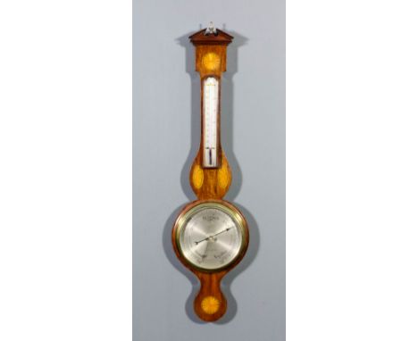An Edwardian mahogany cased aneroid wheel barometer and thermometer retailed by J. Parkes & Sons, 11 St. George 's Crescent, 