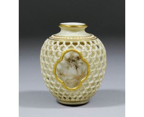 An early 20th Century Royal Worcester porcelain reticulated vase of baluster form, the cream body with gilt highlights and wi