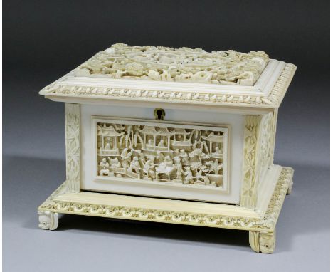 A Chinese ivory rectangular casket, the top deeply carved in bold relief with a shepherd and his flock within shaped cartouch