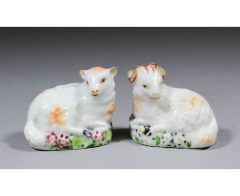 A pair of late 18th Century Derby porcelain figures of a recumbent ram and ewe, on flower encrusted bases, each 1.75ins high 