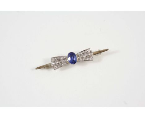 A SAPPHIRE AND DIAMOND BOW BROOCH the oval-shaped sapphire is set with three rows of millegrain set old brilliant-cut diamond