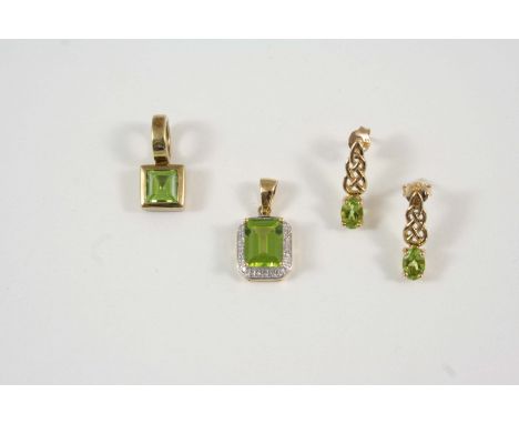 A PERIDOT AND DIAMOND CLUSTER PENDANT the rectangular-shaped peridot is set within a surround of small diamonds, in gold, tog