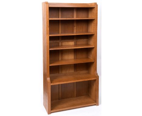 ROBERT THOMPSON OF KILBURN - MOUSEMAN BOOKCASE a tall bookcase with a panel back, with a fixed shelf and 4 adjustable shelves