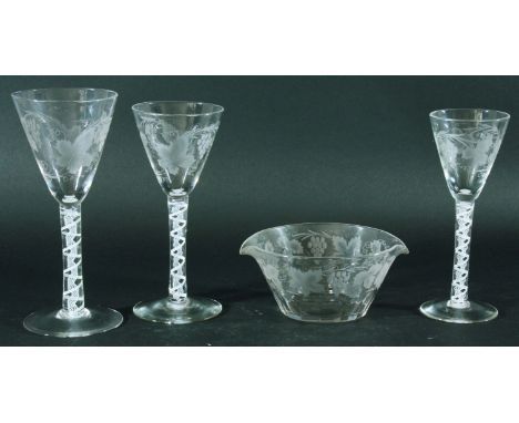 PART SUITE OF GEORGE III STYLE WINE GLASSES, circa 1920, the pointed round funnel bowl with engraved fruiting vine decoration