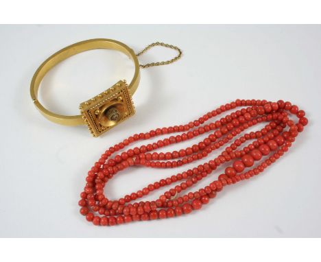 A VICTORIAN 15CT. GOLD BANGLE the central square-shaped section with rope and ball decoration, 19 grams, together with a sing