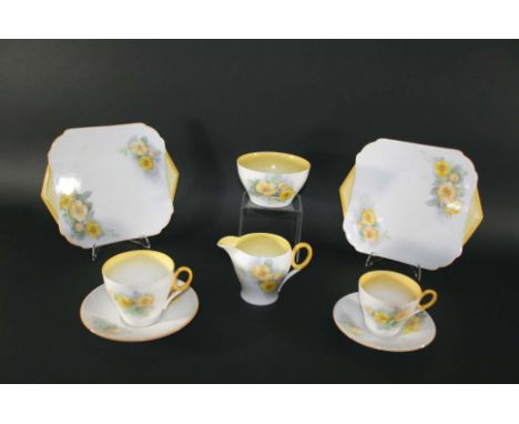 PART SHELLEY TEA SERVICE Pattern No 12338, with a yellow floral design. Comprising a sugar bowl, milk jug, 2 large sandwich p