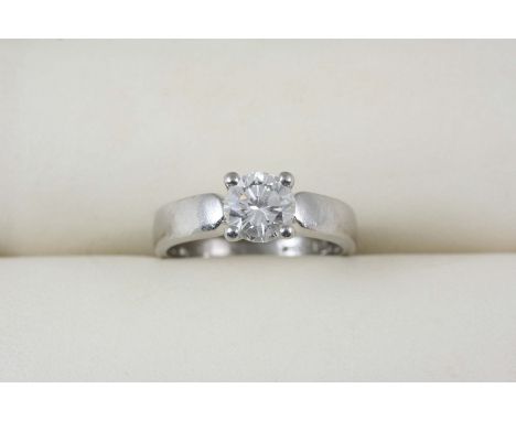 A DIAMOND SOLITAIRE RING the brilliant-cut diamond weighs approximately 1.05 carats and is set in platinum, the shank inscrib