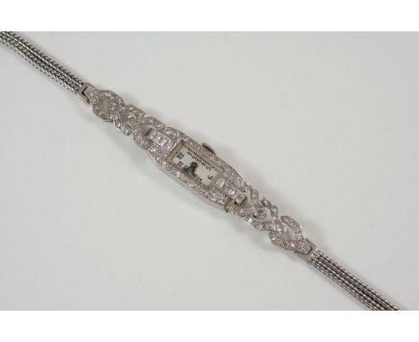 AN ART DECO LADY'S DIAMOND WRISTWATCH the rectangular-shaped dial with Arabic numerals, with single-cut and baguette-cut diam