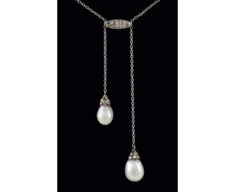 AN EDWARDIAN NATURAL PEARL AND DIAMOND DOUBLE DROP PENDANT each drop shaped pearl suspends from a rose-cut diamond cap, on a 