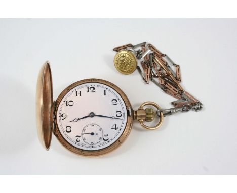 A 9CT. GOLD FULL HUNTING CASED POCKET WATCH the white enamel dial with Arabic numerals and subsidiary seconds dial, glass mis