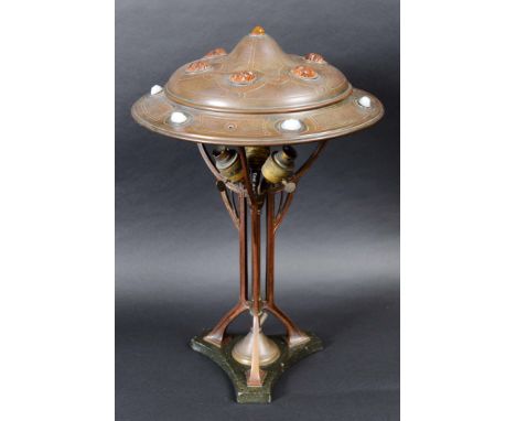 ART NOUVEAU CONTINENTAL LAMP & SHADE the metal lamp with three feet, supporting a three branch light fitting and a floral des